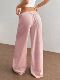 Women's plus size cotton drawstring wide leg pants in Pink, showing relaxed fit and tie waist.
