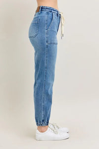 Judy Blue High Waist Denim Jogger in blue wash on model