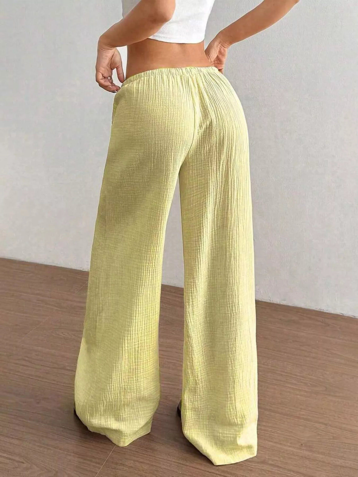Women's plus size cotton drawstring wide leg pants, showing relaxed fit and tie waist.