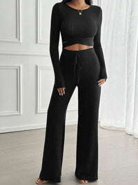 Devine Crisscross Round Neck Long Sleeve Top and Pants Set in [color], featuring a stylish crisscross design on the round neck top, paired with matching long pants. Perfect for a chic and comfortable outfit.